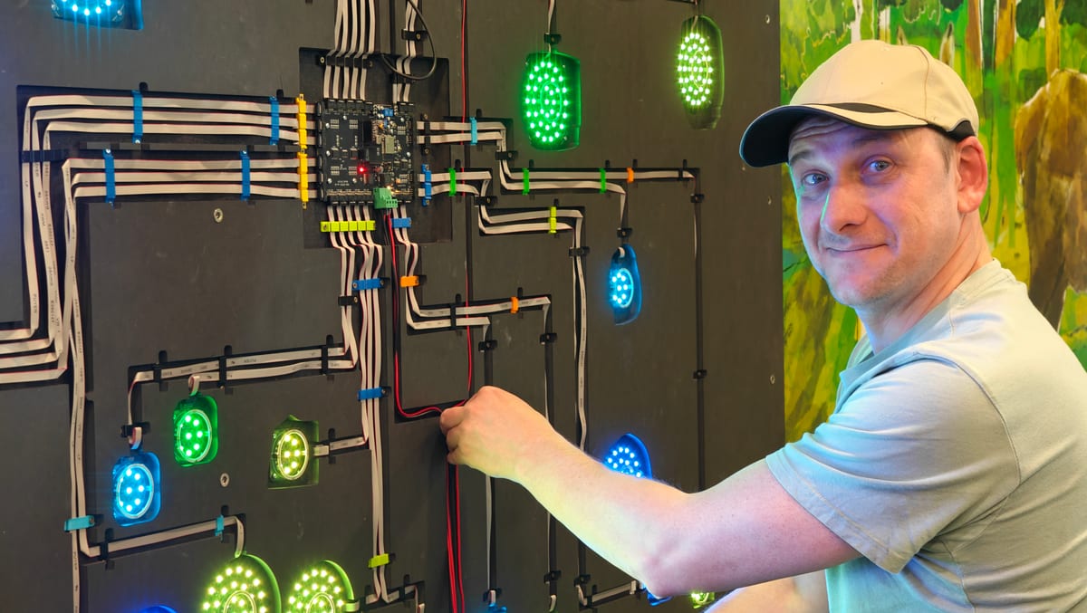 CTRL+N technician wiring an LED reaction wall